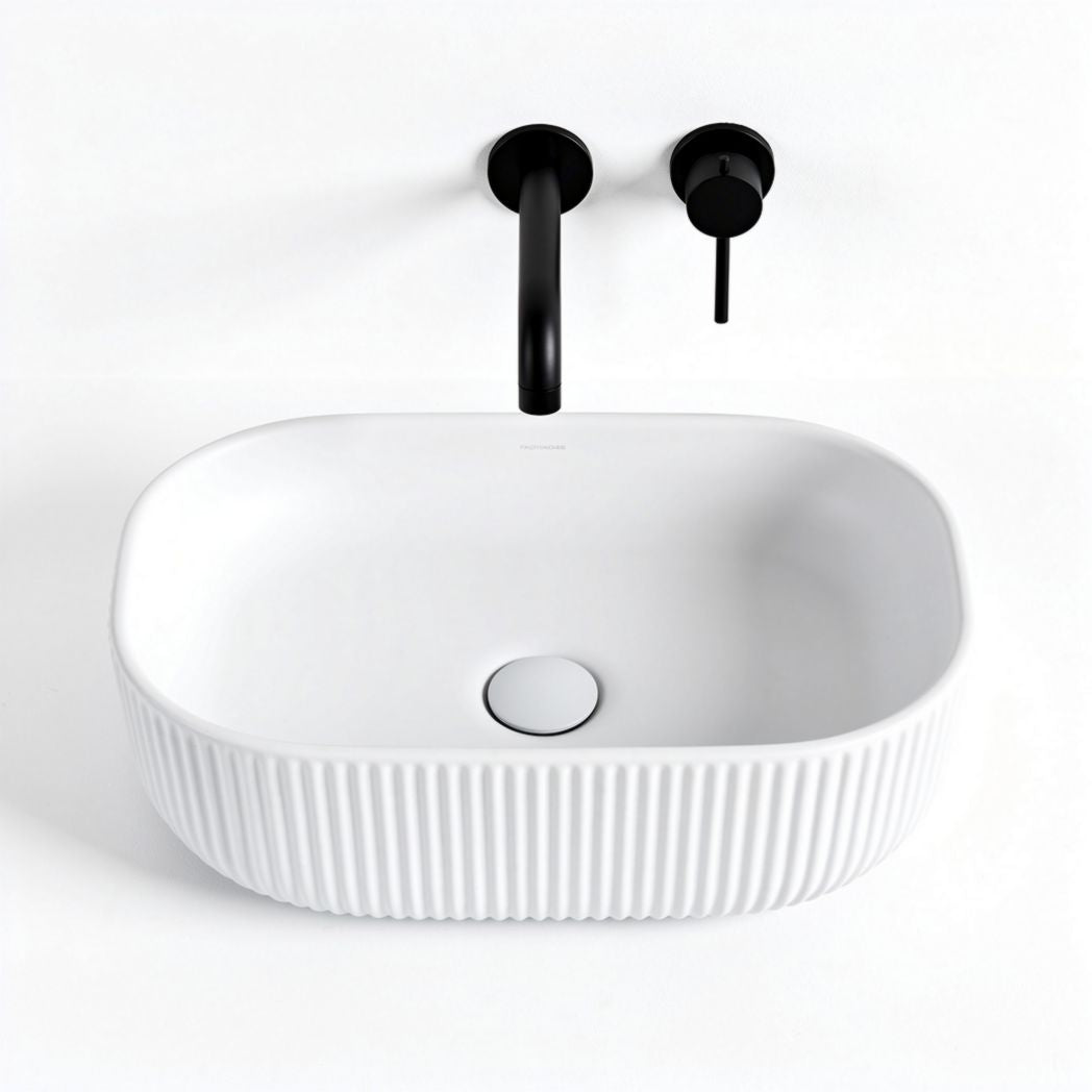 Ceramic oval sink with ribbed design and matte black faucet finish 40 x 25 x 12cm